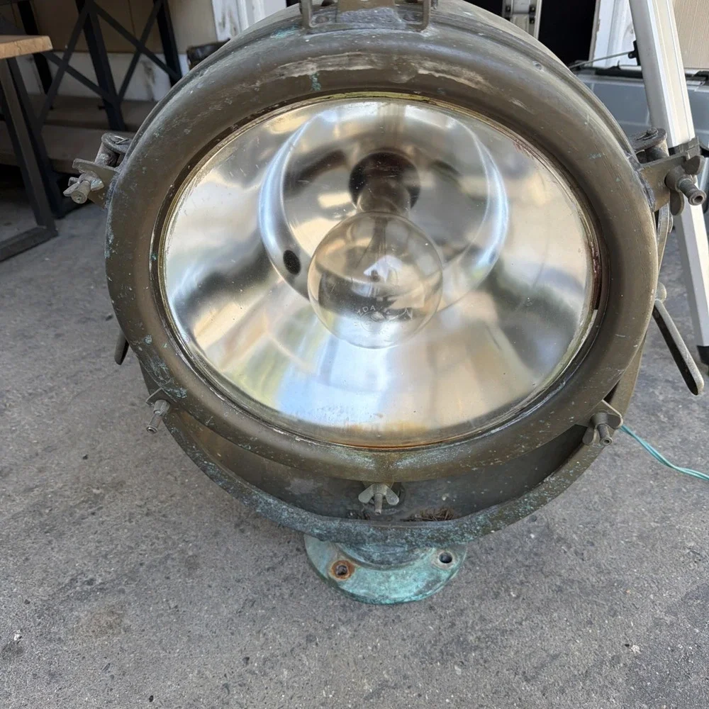 vintage metal marine spotlight closely resembling mid-20th-century naval Search